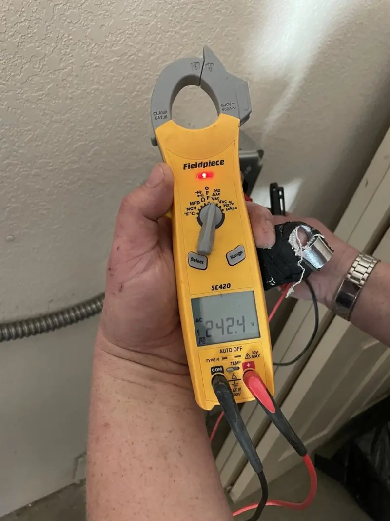 Voltage testing with clamp meter during Aluminum Wiring Replacement in Alvarado